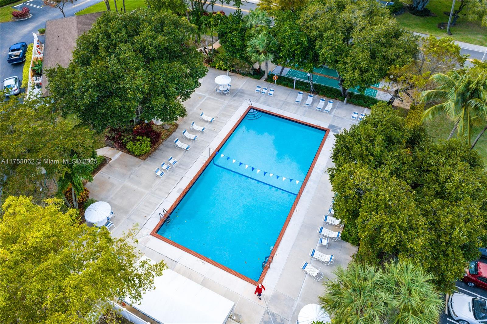 3800 Oaks Clubhouse Drive, Unit 307 Pompano Beach, FL 33069 - Photo 21 of 25 an aerial view of a house