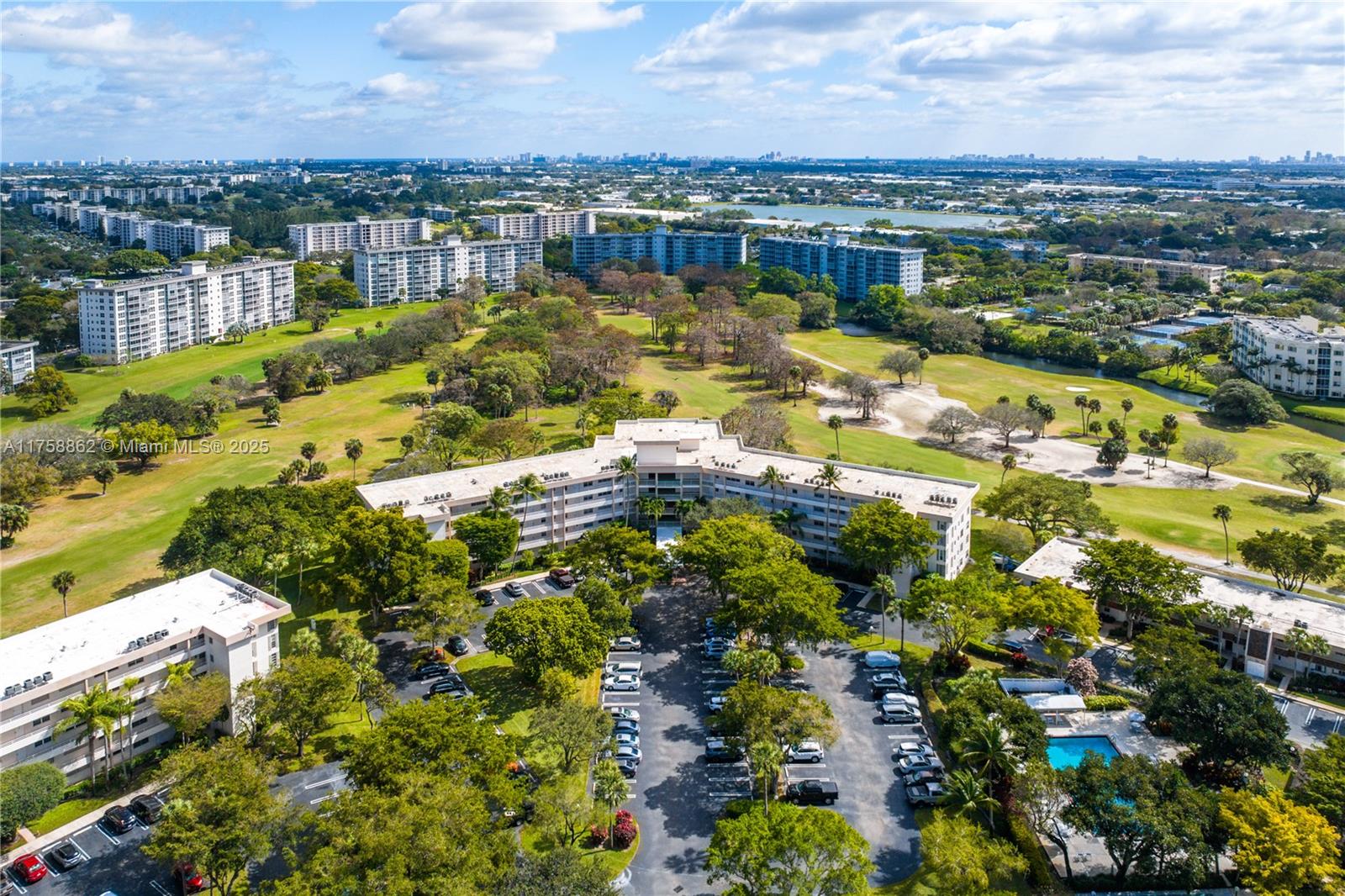 3800 Oaks Clubhouse Drive, Unit 307 Pompano Beach, FL 33069 - Photo 22 of 25 a view of a city