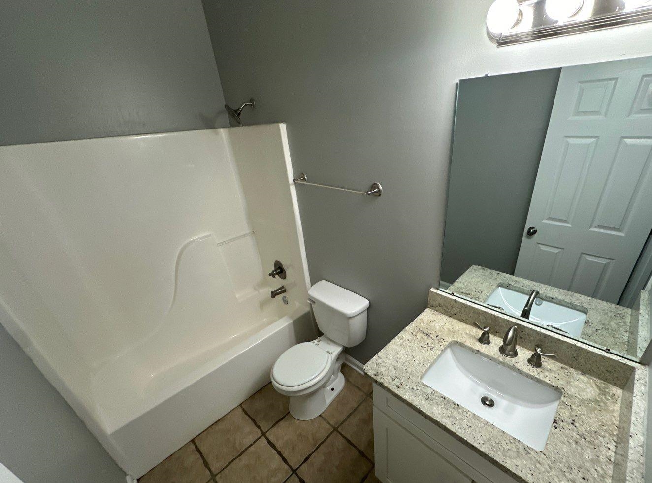 9420 Grove Road Cordova, TN 38016 - Photo 14 of 15 a bathroom with a sink toilet and shower