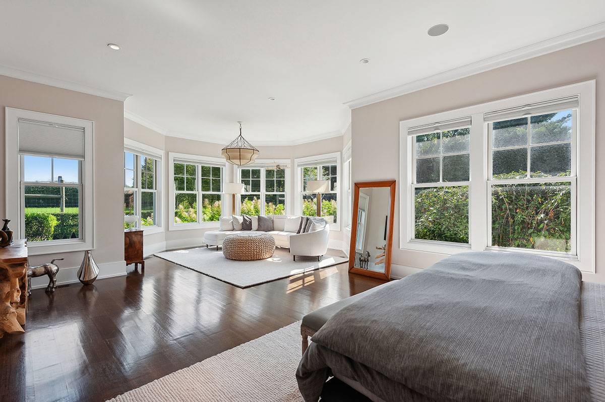 63 Newlight Lane Bridgehampton, NY 11976 - Photo 15 of 37 a living room with furniture and a large window
