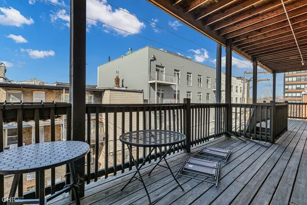 a view of balcony with wooden floor