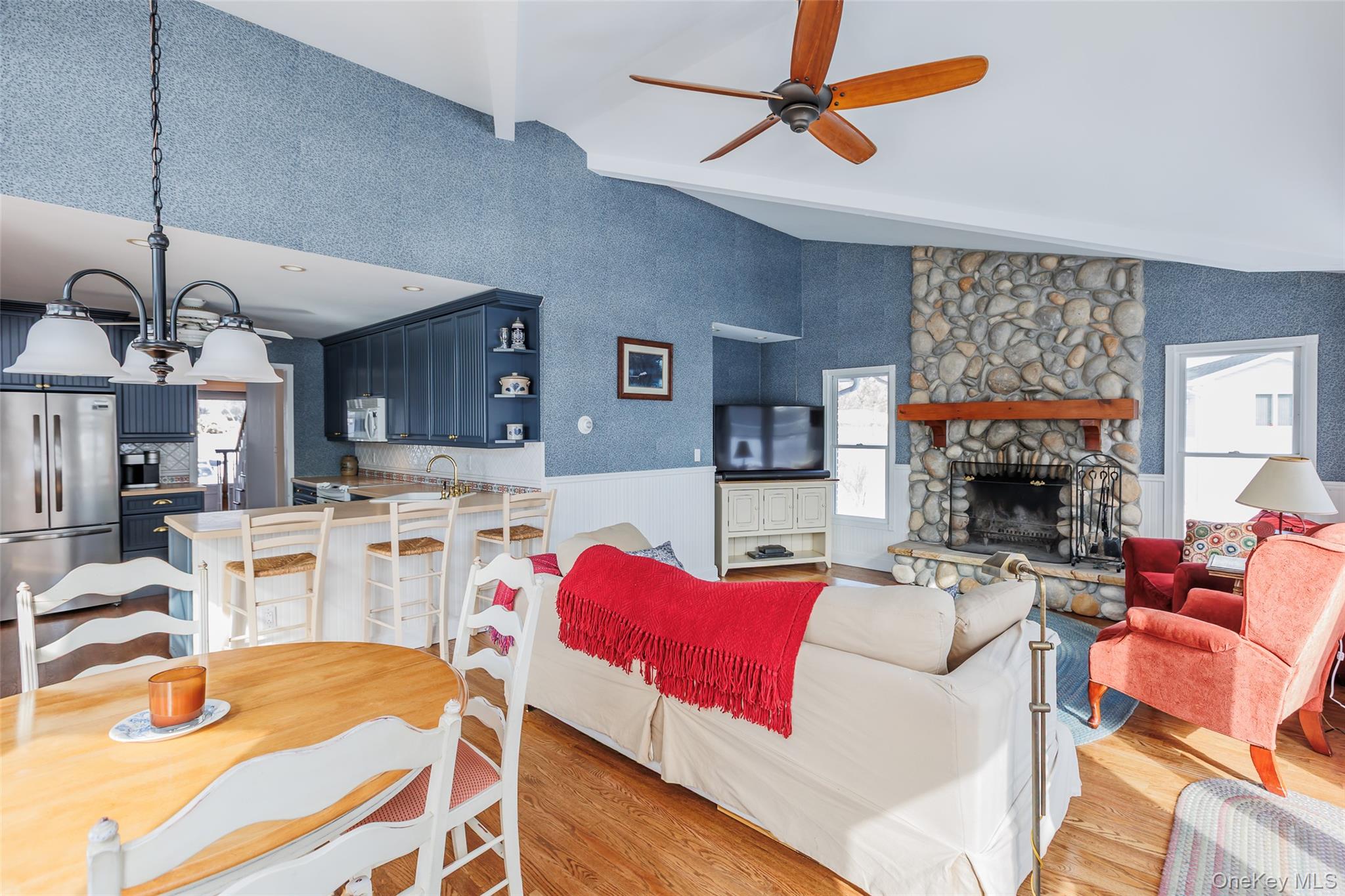 45 Terry Lane Commack, NY 11725 - Photo 14 of 34 a living room with furniture a fireplace and a chandelier