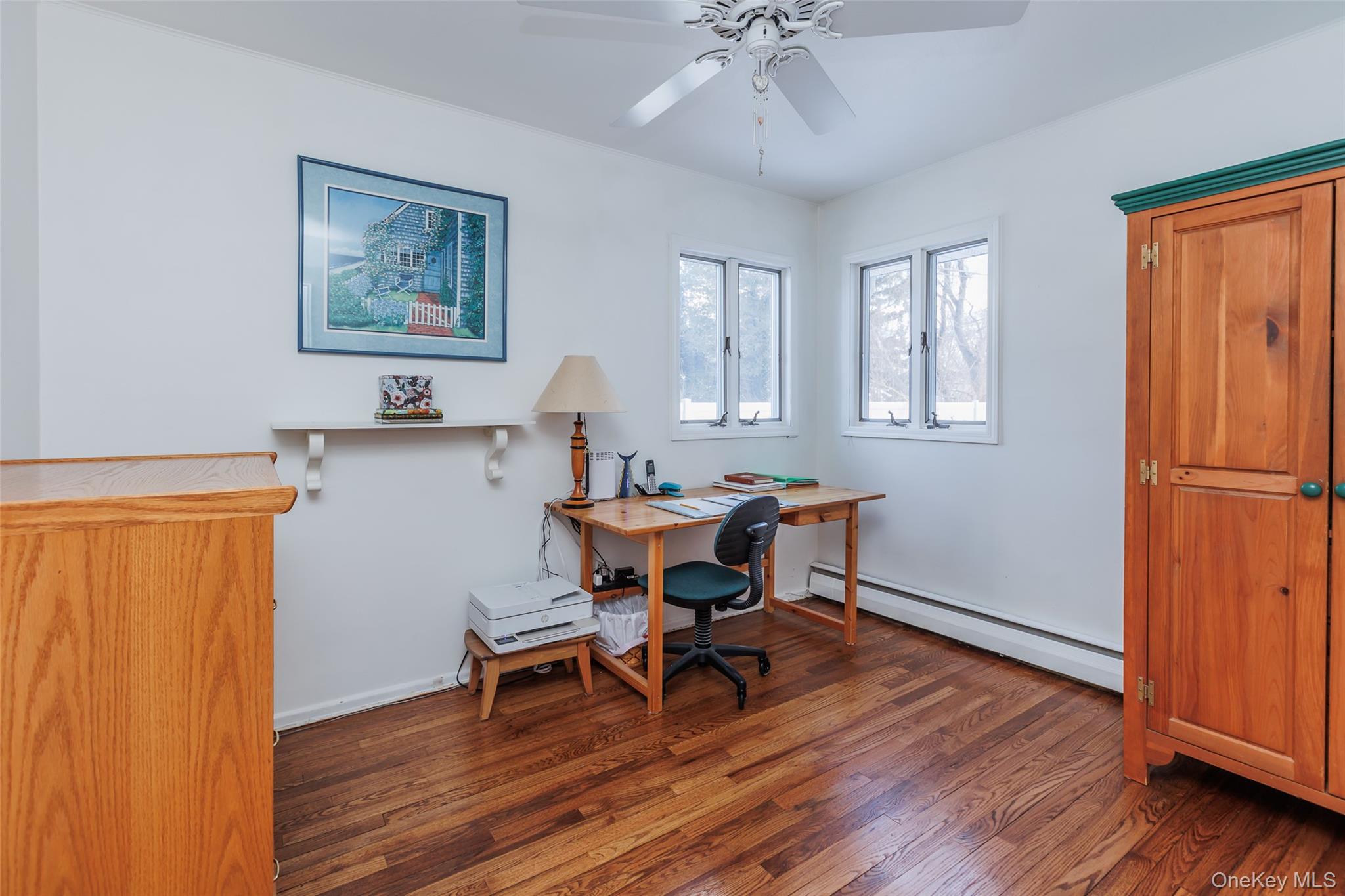 45 Terry Lane Commack, NY 11725 - Photo 17 of 34 a workspace with wooden floor and a workspace