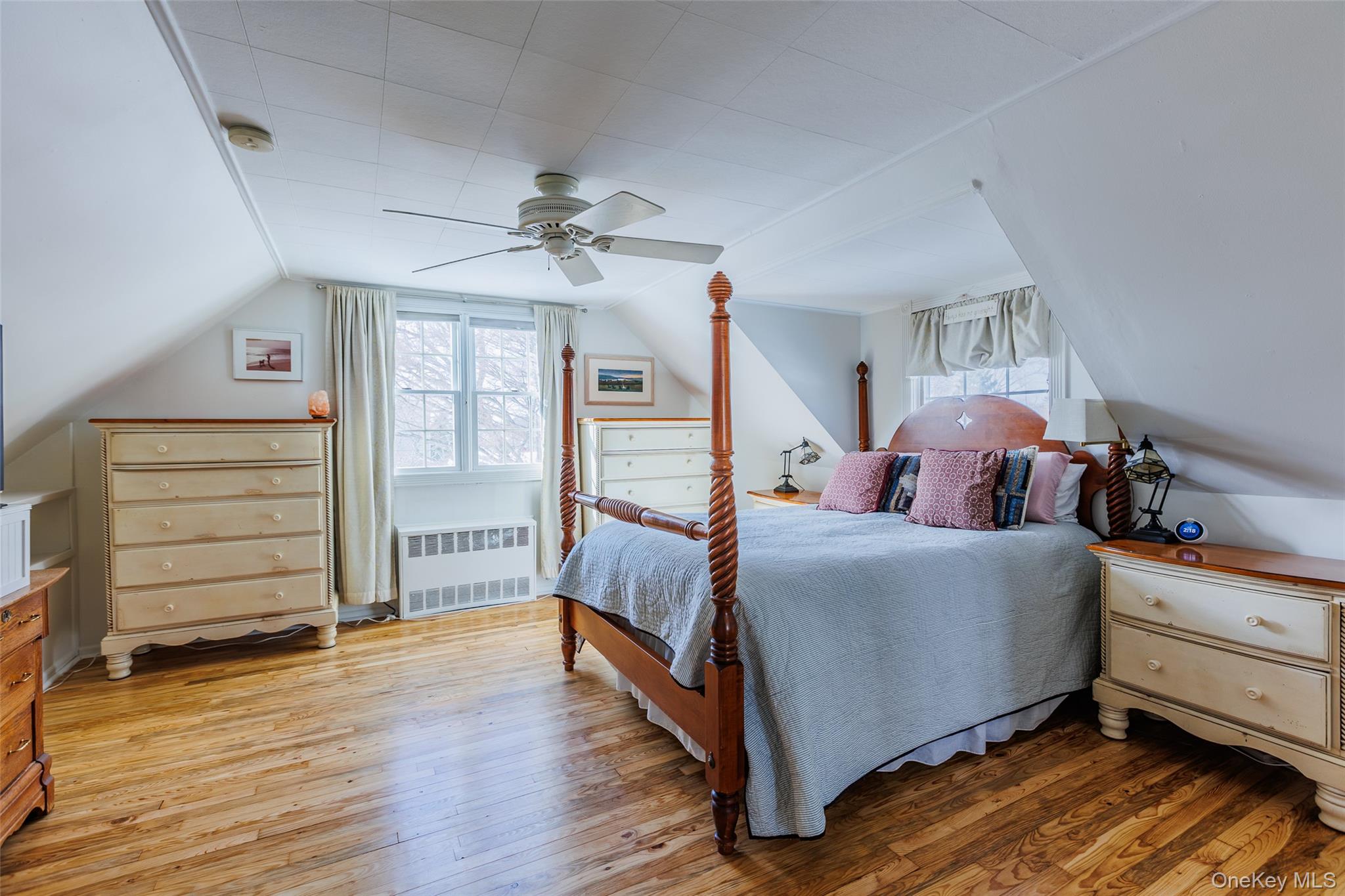 45 Terry Lane Commack, NY 11725 - Photo 18 of 34 a bed room with a bed and a ceiling fan