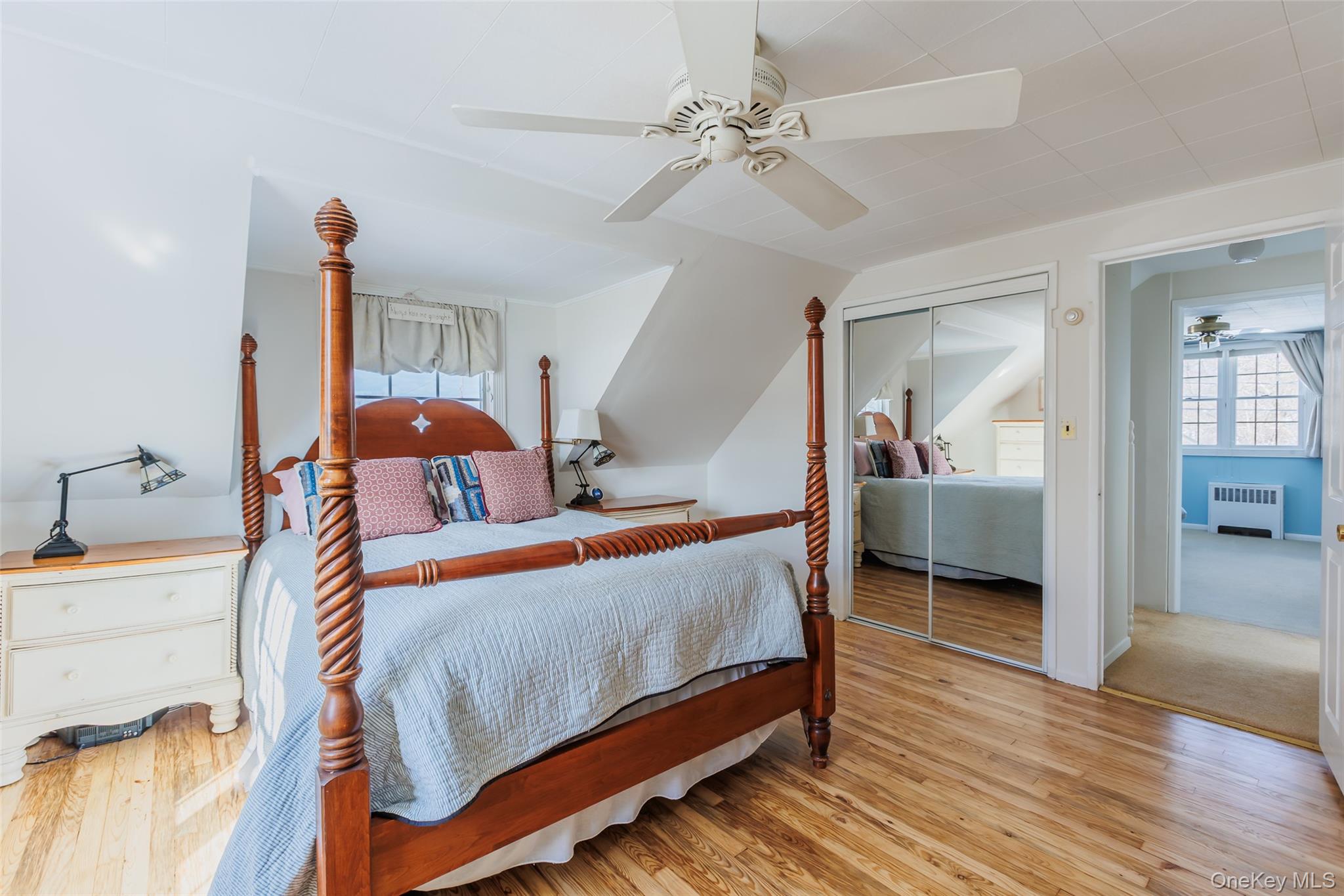 45 Terry Lane Commack, NY 11725 - Photo 19 of 34 a bedroom with furniture and a mirror