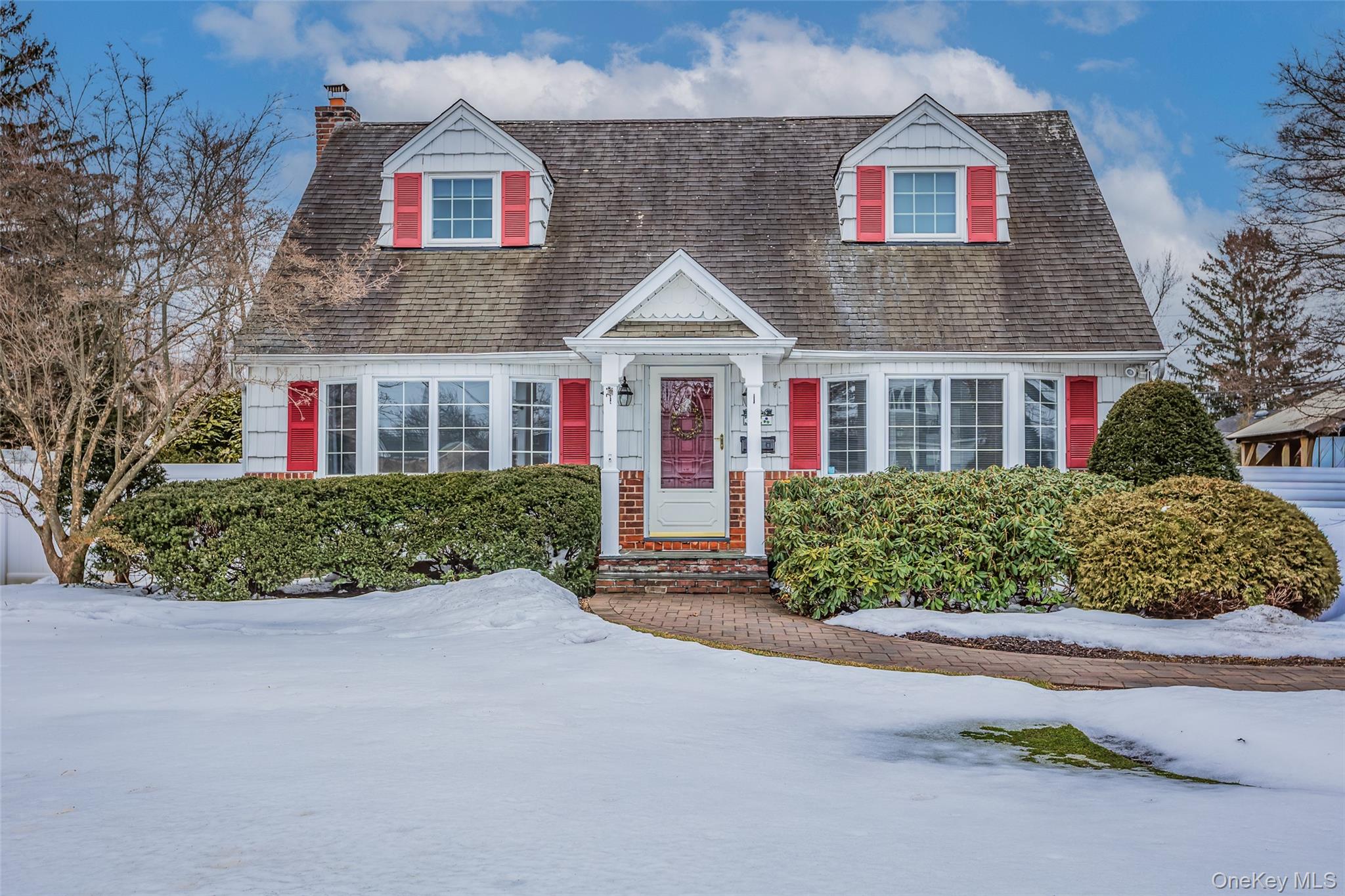 45 Terry Lane Commack, NY 11725 - Photo 2 of 34 a front view of a house with a garden