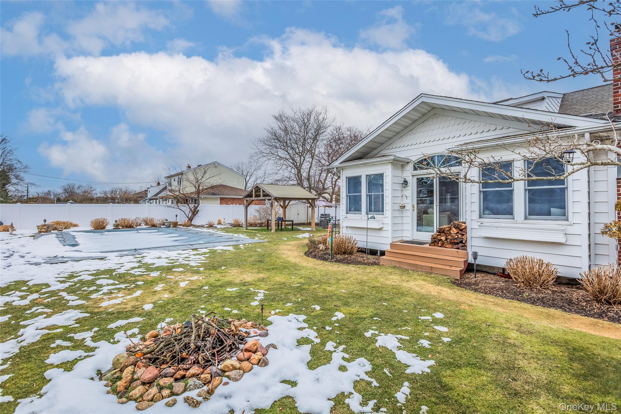 45 Terry Lane Commack, NY 11725 - Photo 25 of 34 a view of a house with swimming pool and sitting area