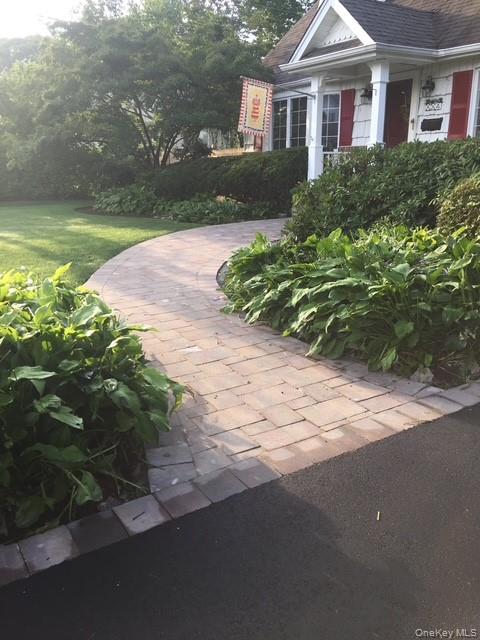 45 Terry Lane Commack, NY 11725 - Photo 3 of 34 a front view of a house with garden