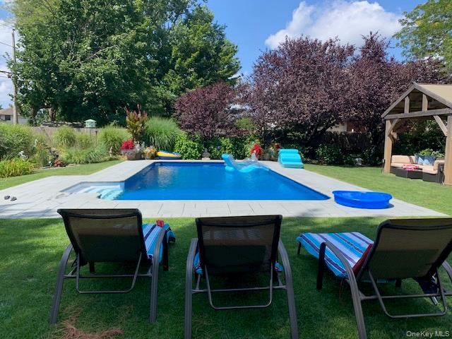45 Terry Lane Commack, NY 11725 - Photo 31 of 34 a view of backyard with seating space and trees