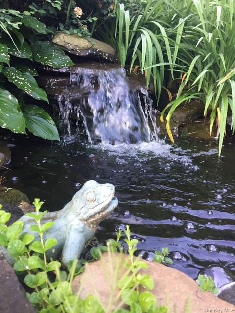 45 Terry Lane Commack, NY 11725 - Photo 33 of 34 a backyard of a house with lots of green space