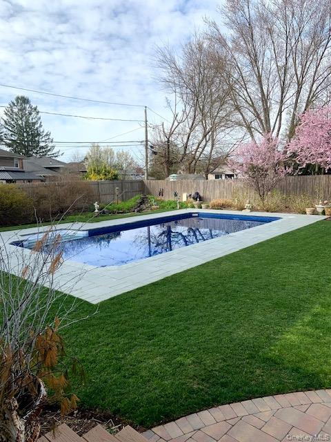 45 Terry Lane Commack, NY 11725 - Photo 34 of 34 a view of a swimming pool with a yard