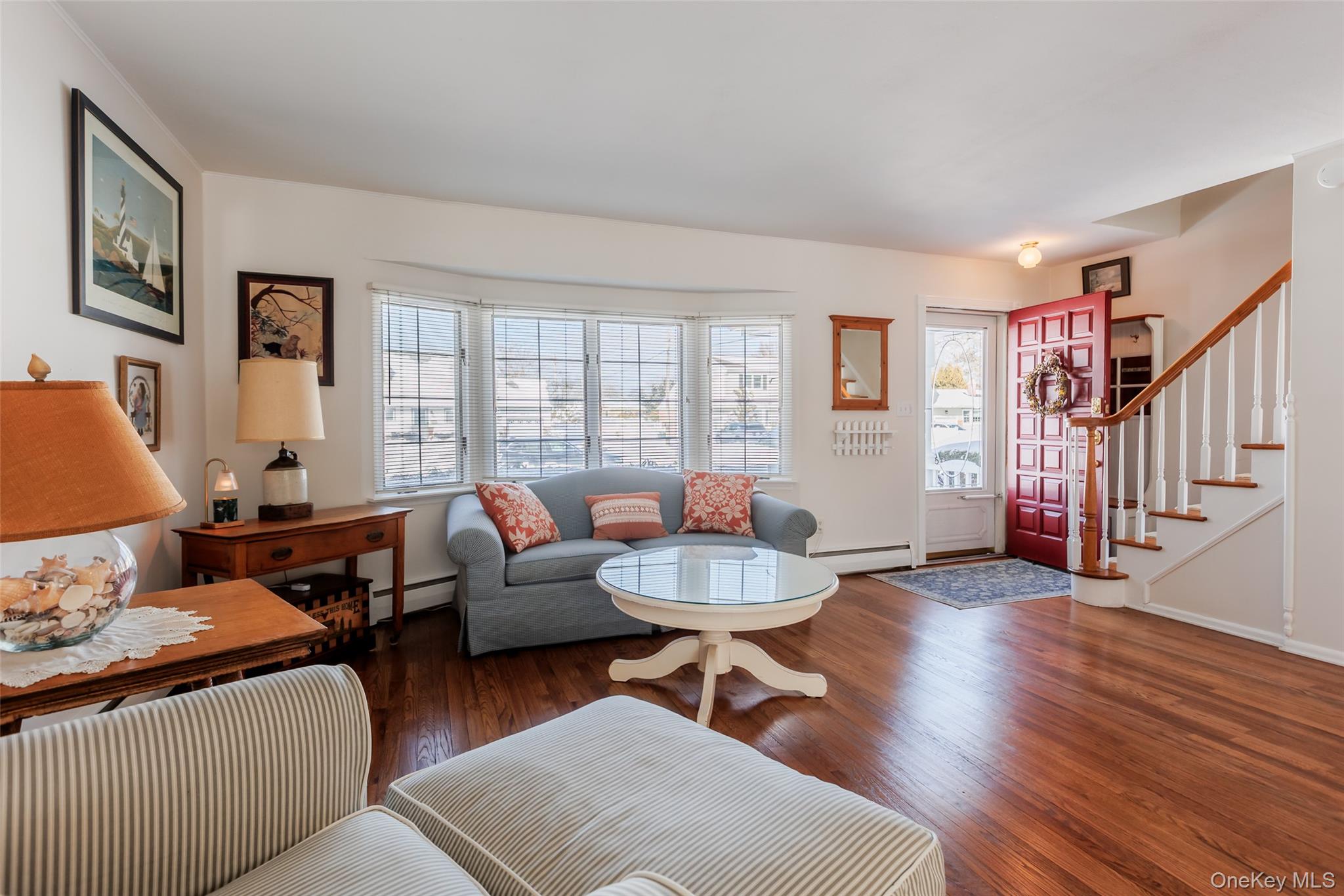 45 Terry Lane Commack, NY 11725 - Photo 4 of 34 a living room with furniture and a wooden floor