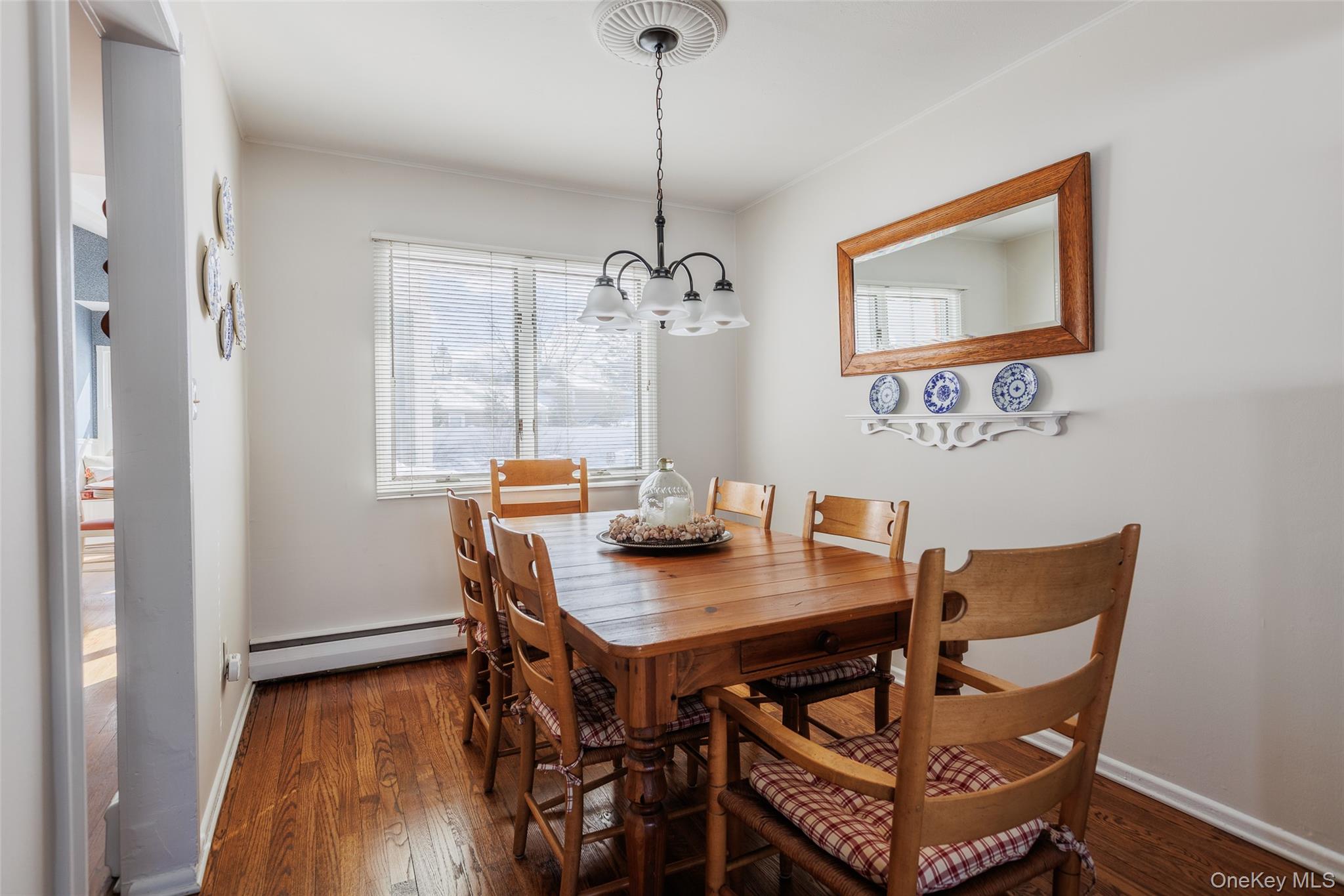 45 Terry Lane Commack, NY 11725 - Photo 7 of 34 a view of a dining room with furniture window and wooden floor