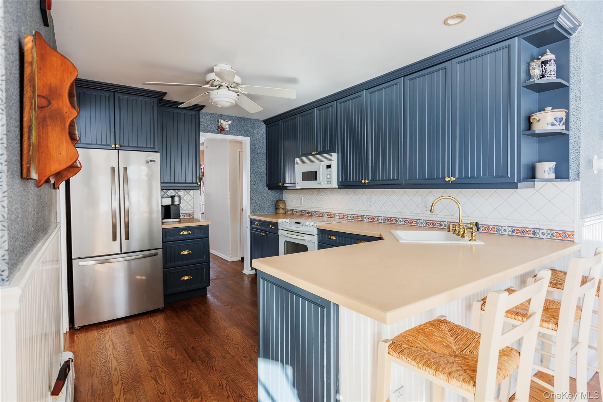 45 Terry Lane Commack, NY 11725 - Photo 9 of 34 a kitchen with a refrigerator a stove top oven a sink and dishwasher