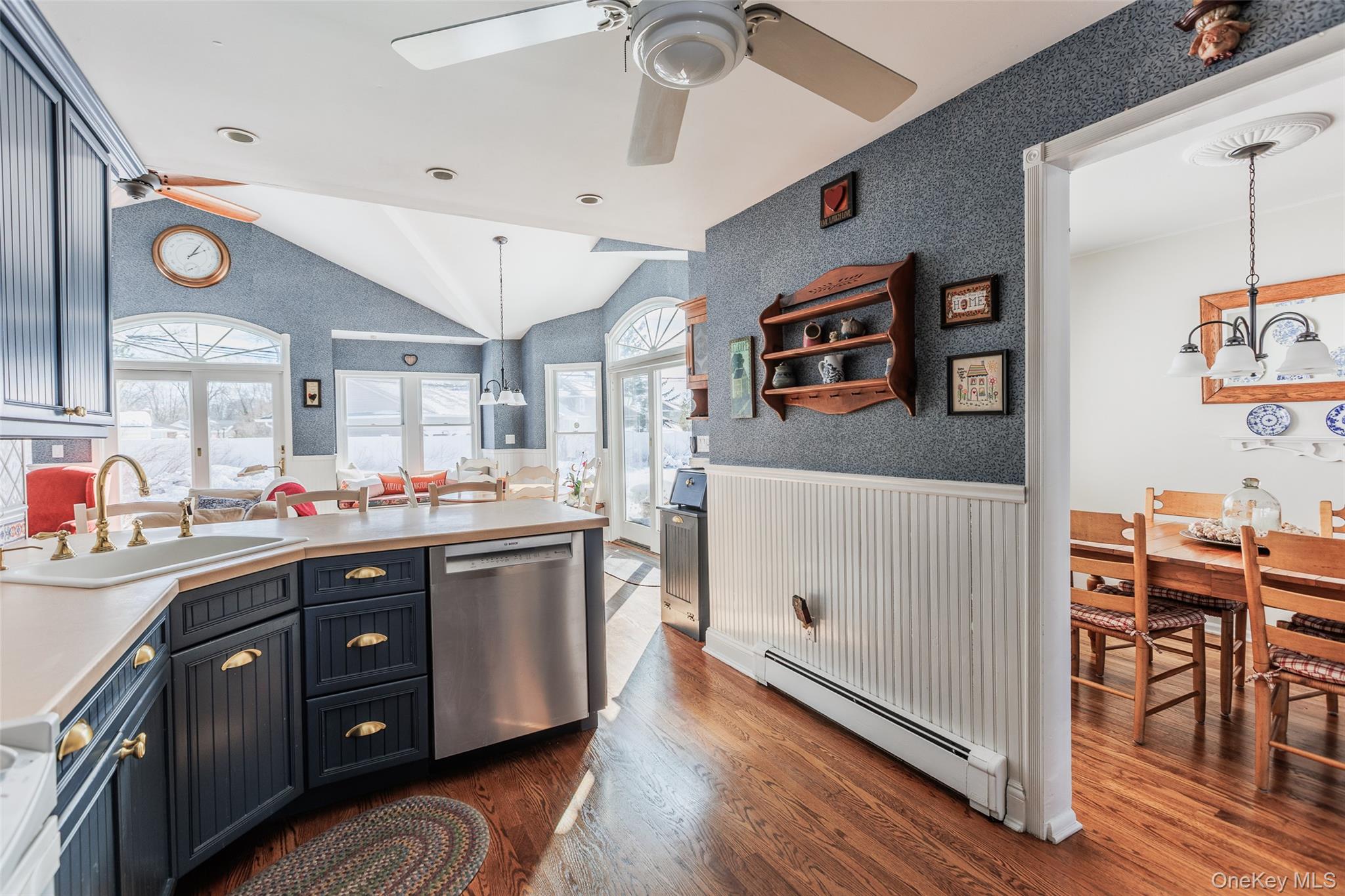 45 Terry Lane Commack, NY 11725 - Photo 10 of 34 a kitchen with stainless steel appliances a stove cabinets and wooden floor