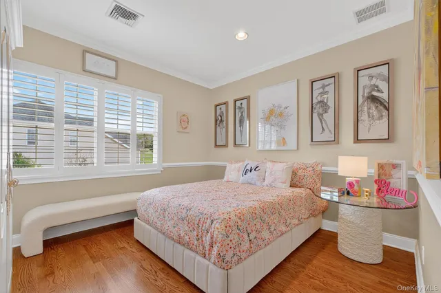 a spacious bathroom with a sink and a mirror