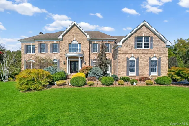 an aerial view of a house with a big yard