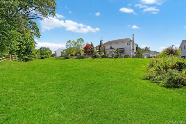 a view of a fountain in the backyard of a house