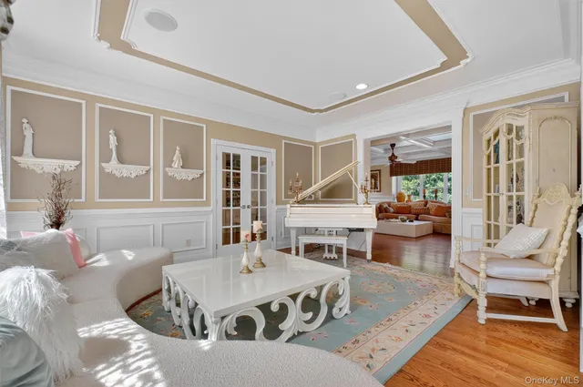 a view of entryway livingroom and hall with wooden floor