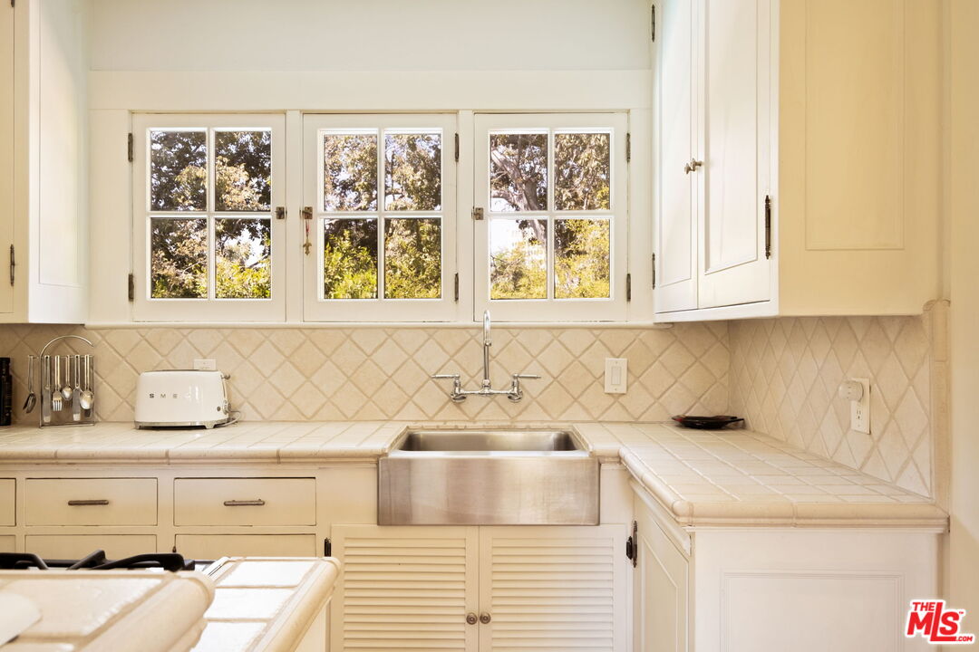 1205 Arden Road Pasadena, CA 91106 - Photo 20 of 24 a bathroom with a sink and a window