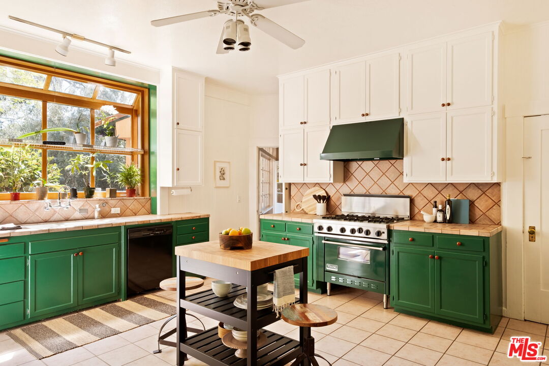 1205 Arden Road Pasadena, CA 91106 - Photo 9 of 24 a kitchen with a table chairs and a window