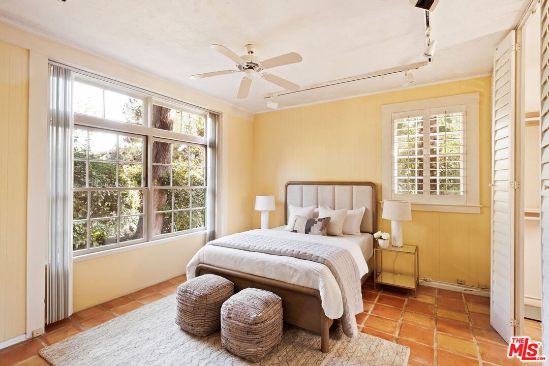 1205 Arden Road Pasadena, CA 91106 - Photo 10 of 24 a bedroom with a bed and wooden floor