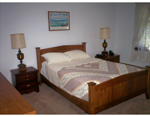 22 Spruce Road Medway, MA 02053 - Photo 17 of 17 a spacious bedroom with a bed and a lamp on table
