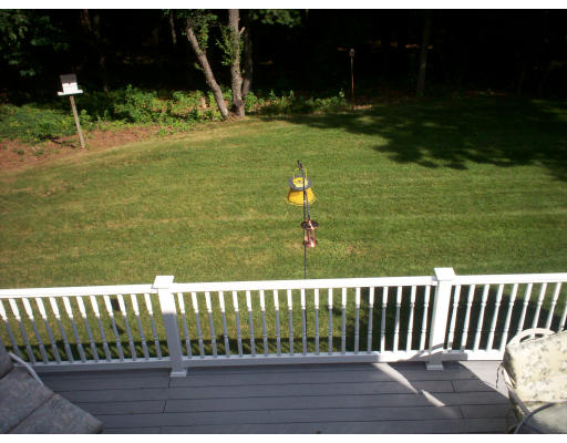 22 Spruce Road Medway, MA 02053 - Photo 8 of 17 a view of a table and chairs in the patio