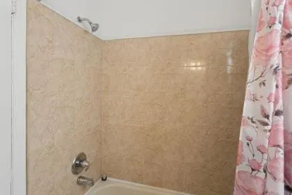 a bathroom with a shower curtain