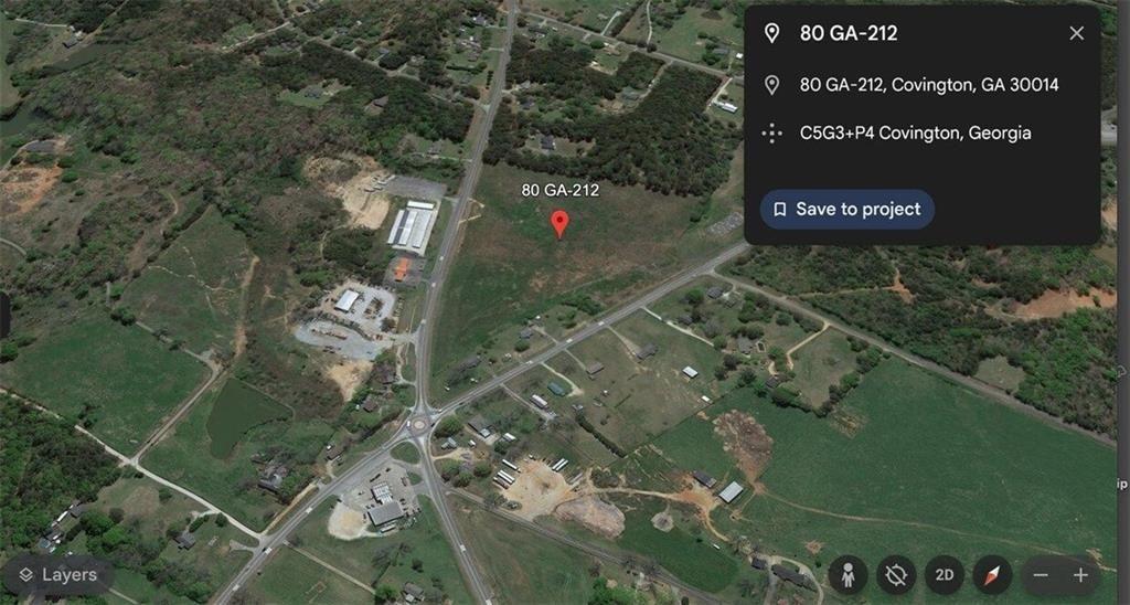 80 Highway 212 Covington, GA 30014 - Photo 7 of 7 a sign that is sitting on a brick wall