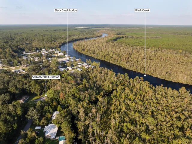a view of a porch with furniture and a yard