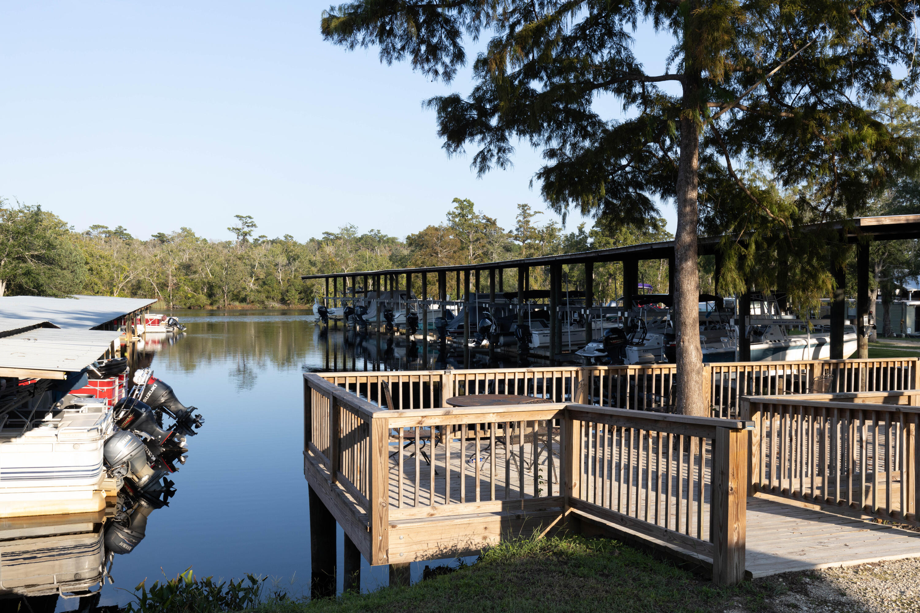 Lot Xx Stillwater Road Freeport, FL 32439 - Photo 15 of 20 a view of a deck and lake with trees in the background