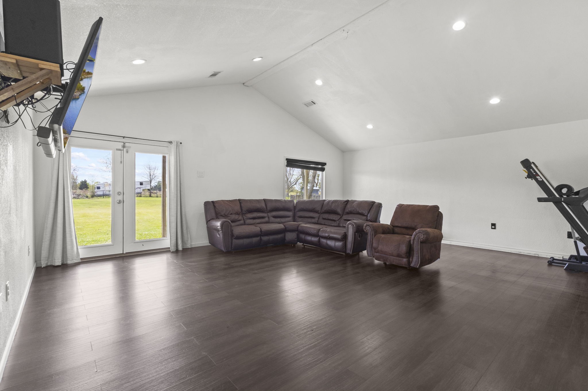 19961 Englin Road Winnie, TX 77665 - Photo 13 of 26 a living room with furniture and a wooden floor