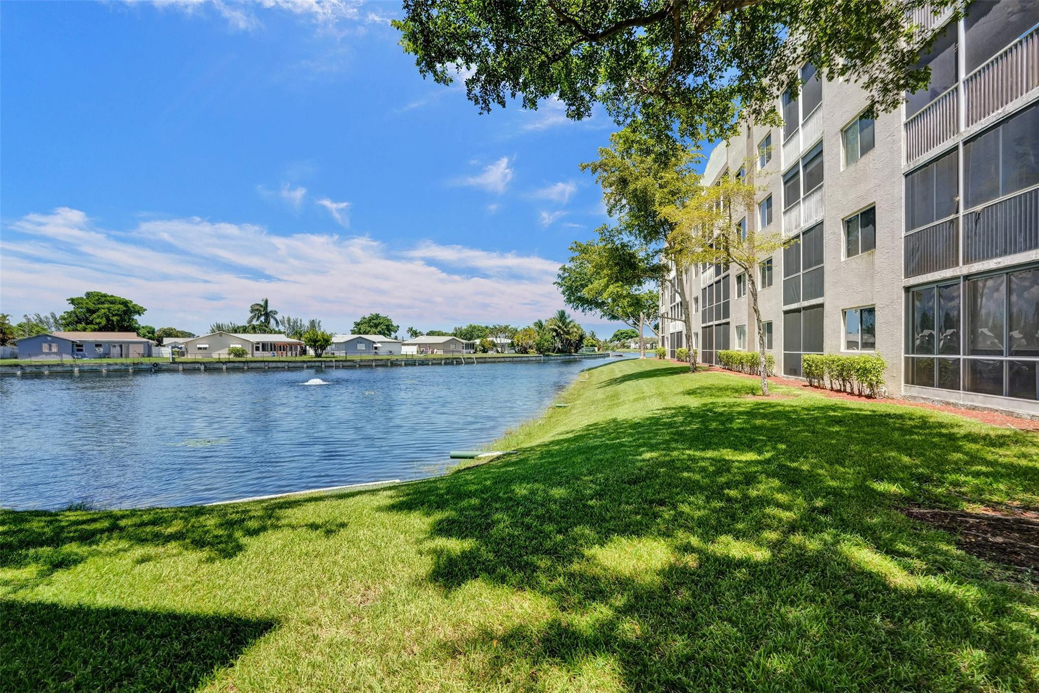 9575 Weldon Circle, Unit 305 Tamarac, FL 33321 - Photo 27 of 28 LAKE VIEW FROM DOWNSTAIRS