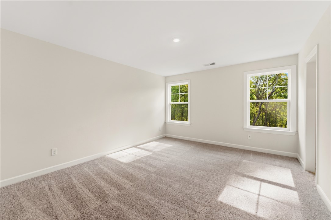 1108 Manse Jolly Road Anderson, SC 29621 - Photo 33 of 45 This spacious room features ample natural light and plush carpeting, perfect for relaxation.