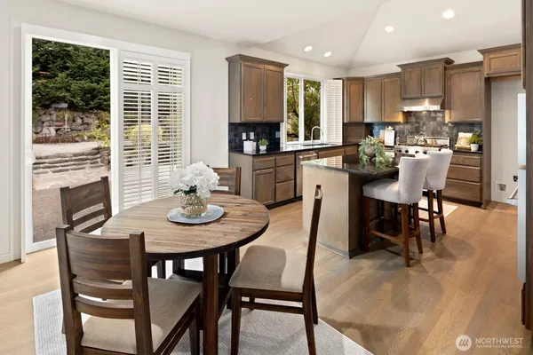a view of a dining room with furniture window and outside view