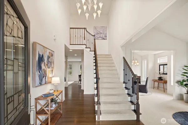 a view of a livingroom with furniture and stairs