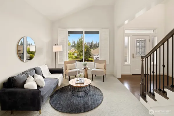 a living room with furniture and a large window