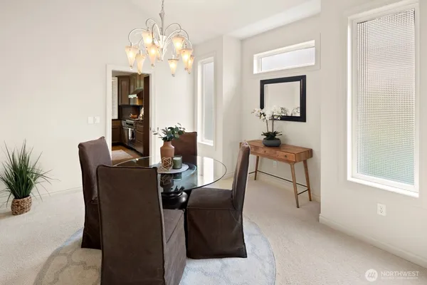 a dining room with furniture and window
