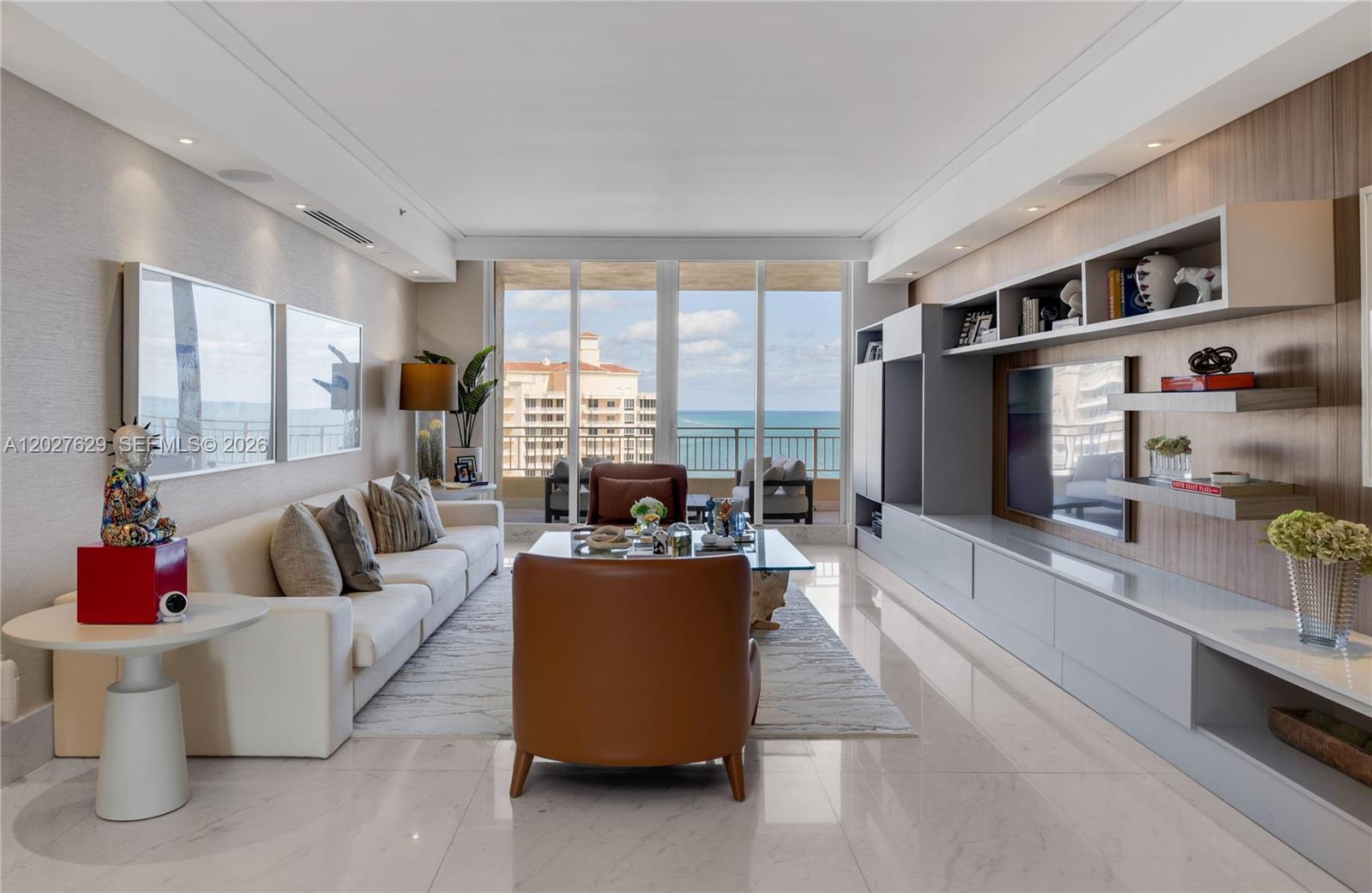 799 Crandon Boulevard, Unit PH8 Key Biscayne, FL 33149 - Photo 3 of 47 a living room with furniture and a flat screen tv
