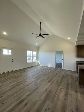 a view of kitchen with sink microwave and stove