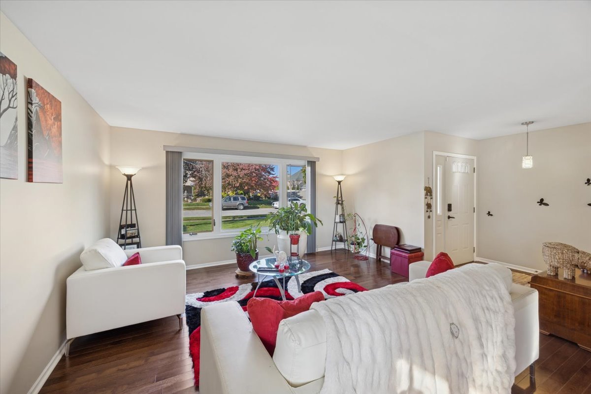 18311 Holland Road Lansing, IL 60438 - Photo 4 of 19 a living room with furniture and a large window