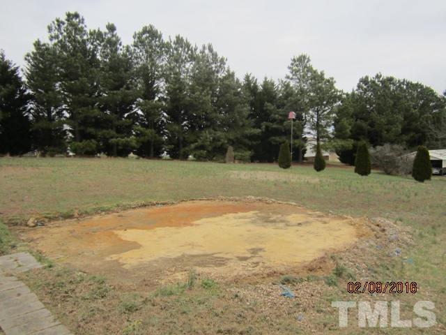 72 New Country Road Roxboro, NC 27574 - Photo 3 of 12 a view of a yard with a tree