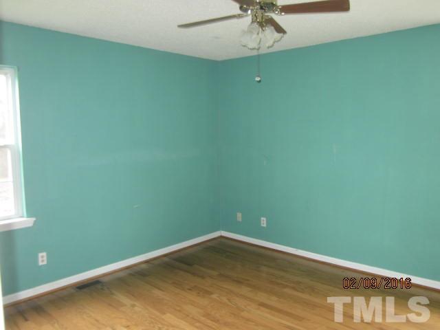 72 New Country Road Roxboro, NC 27574 - Photo 8 of 12 a view of a room with a fan