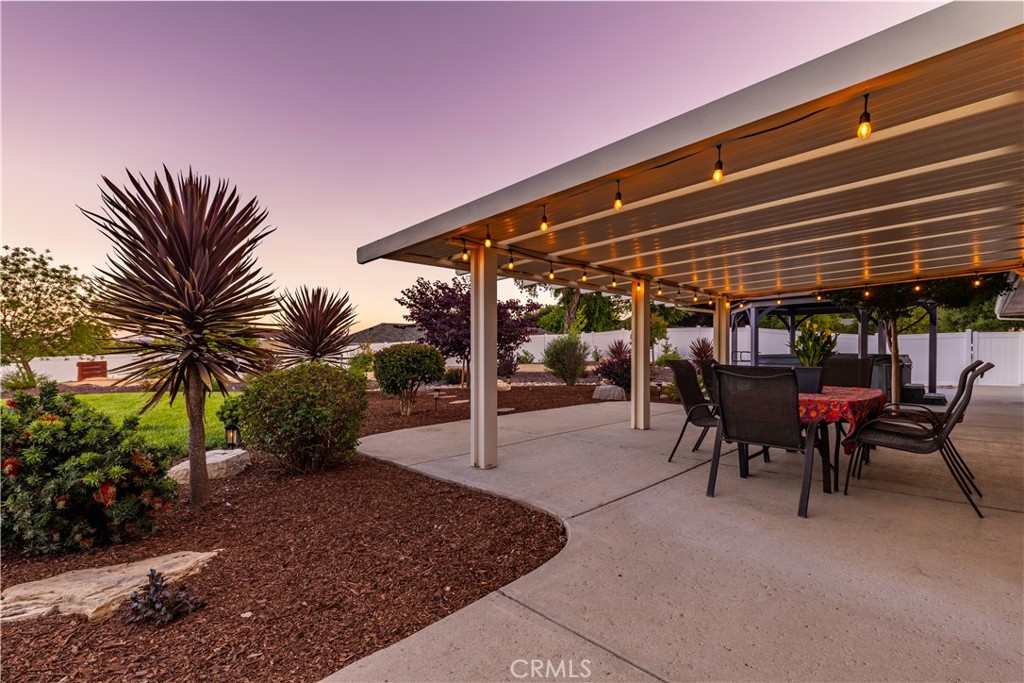 1275 Shane Lane Templeton, CA 93465 - Photo 3 of 70 a view of a patio with a table and chairs under an umbrella