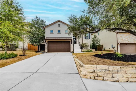 a front view of a house with garage