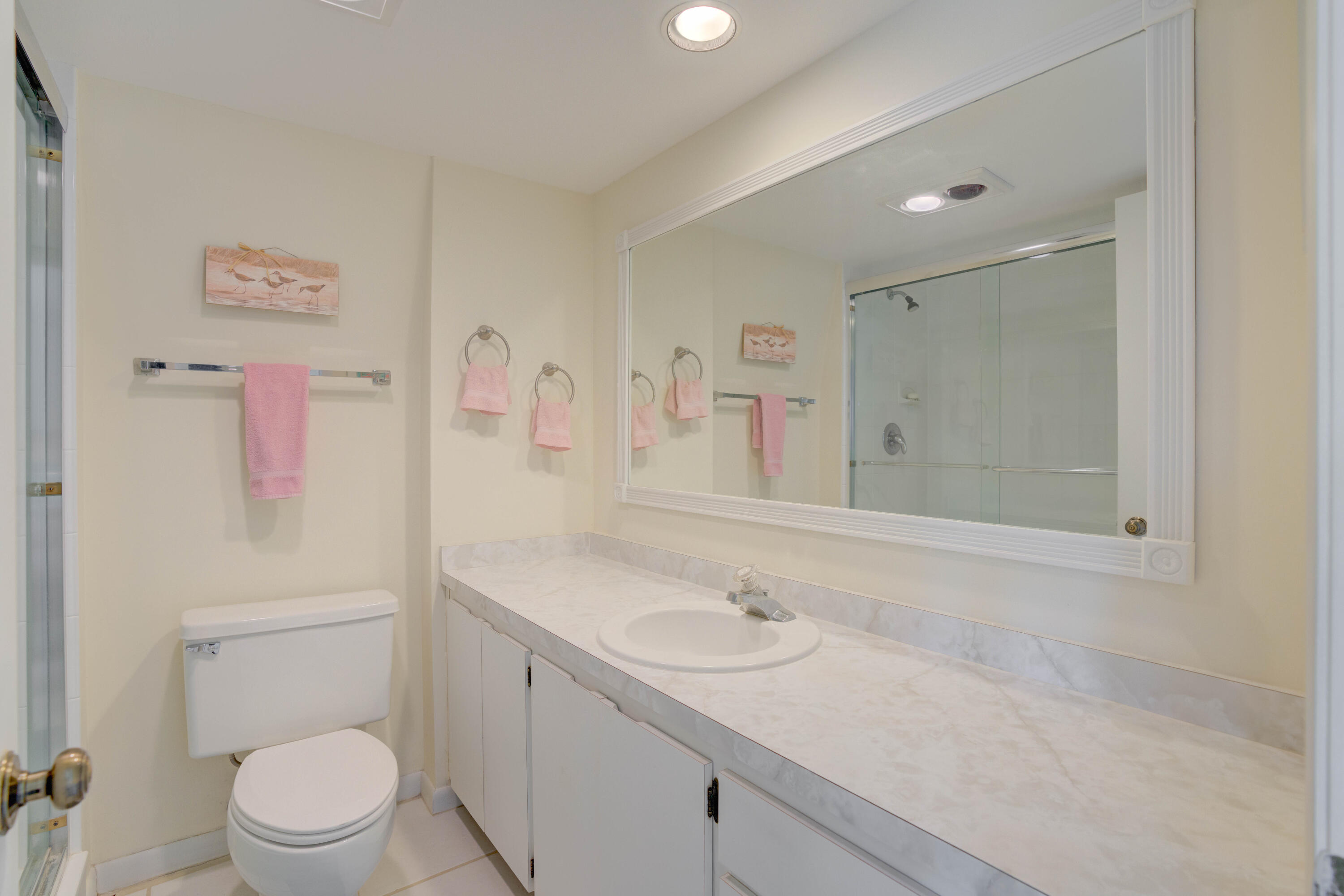 3900 County Line Road, Unit 1C Tequesta, FL 33469 - Photo 22 of 30 Primary bath, shower with glass doors