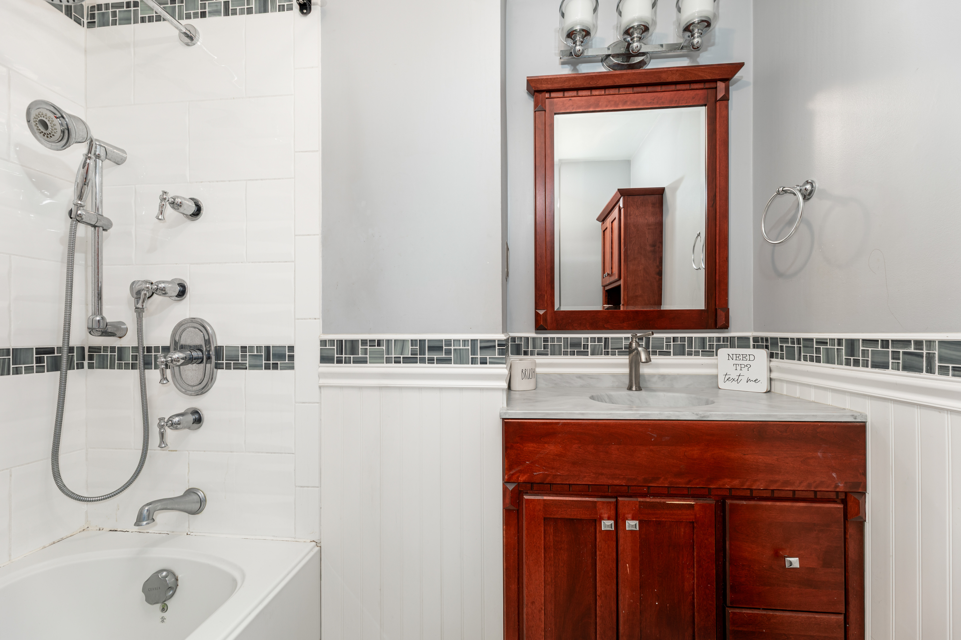 224 Roses Mill Road Milford, CT 06460 - Photo 11 of 30 a bathroom with a sink vanity and a mirror