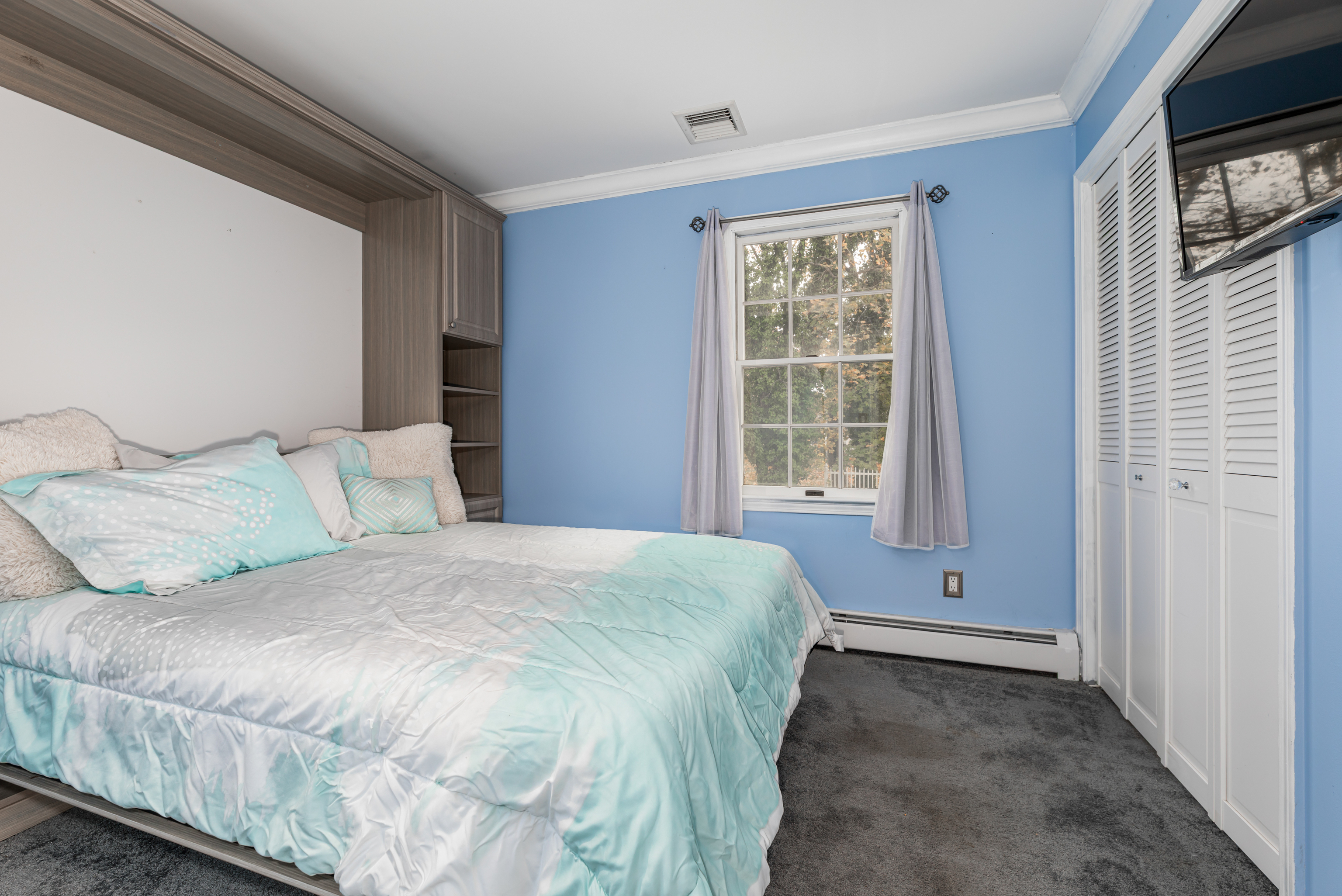 224 Roses Mill Road Milford, CT 06460 - Photo 15 of 30 a spacious bedroom with a bed and a window