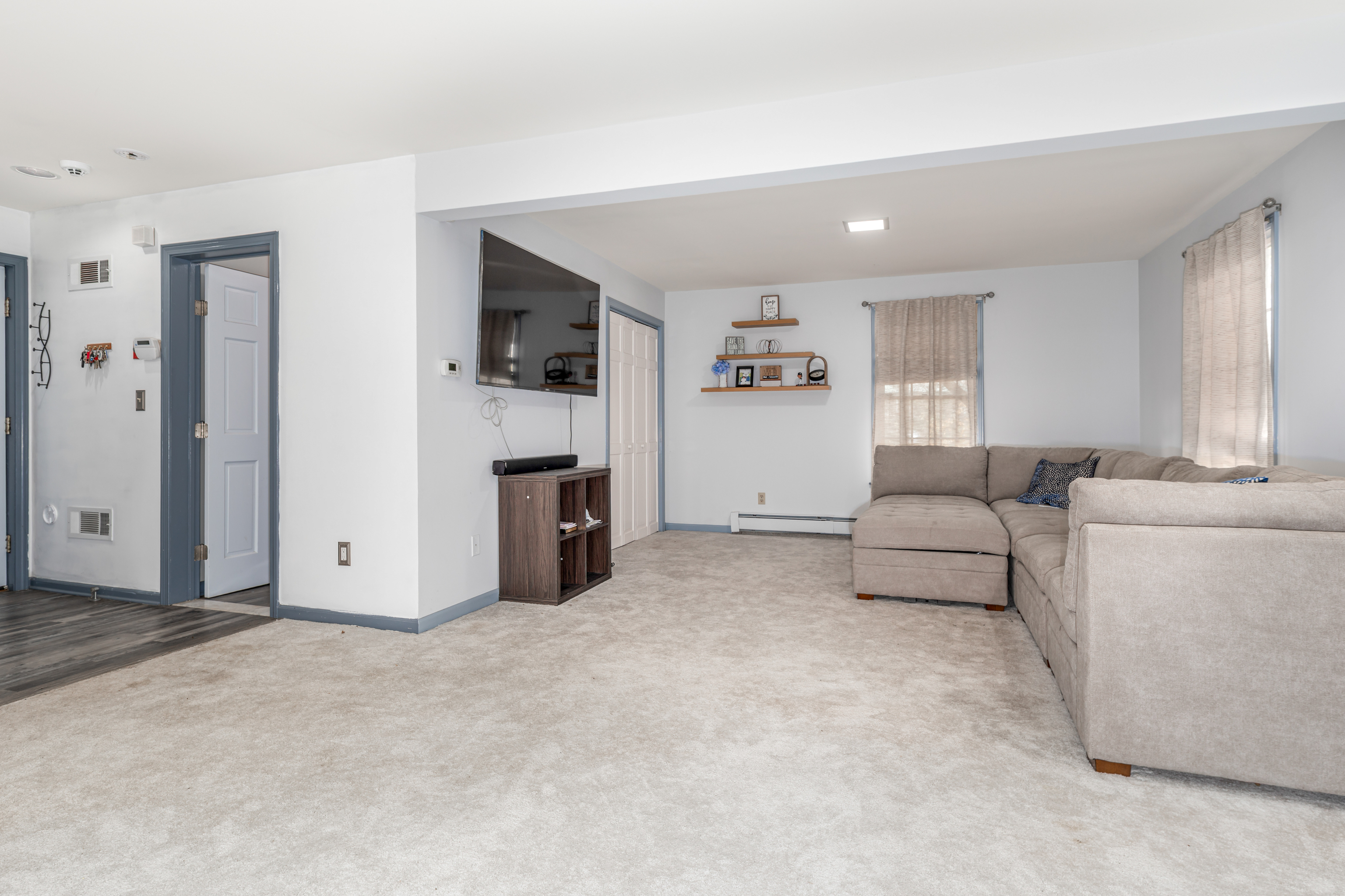 224 Roses Mill Road Milford, CT 06460 - Photo 20 of 30 a living room with furniture and a fireplace